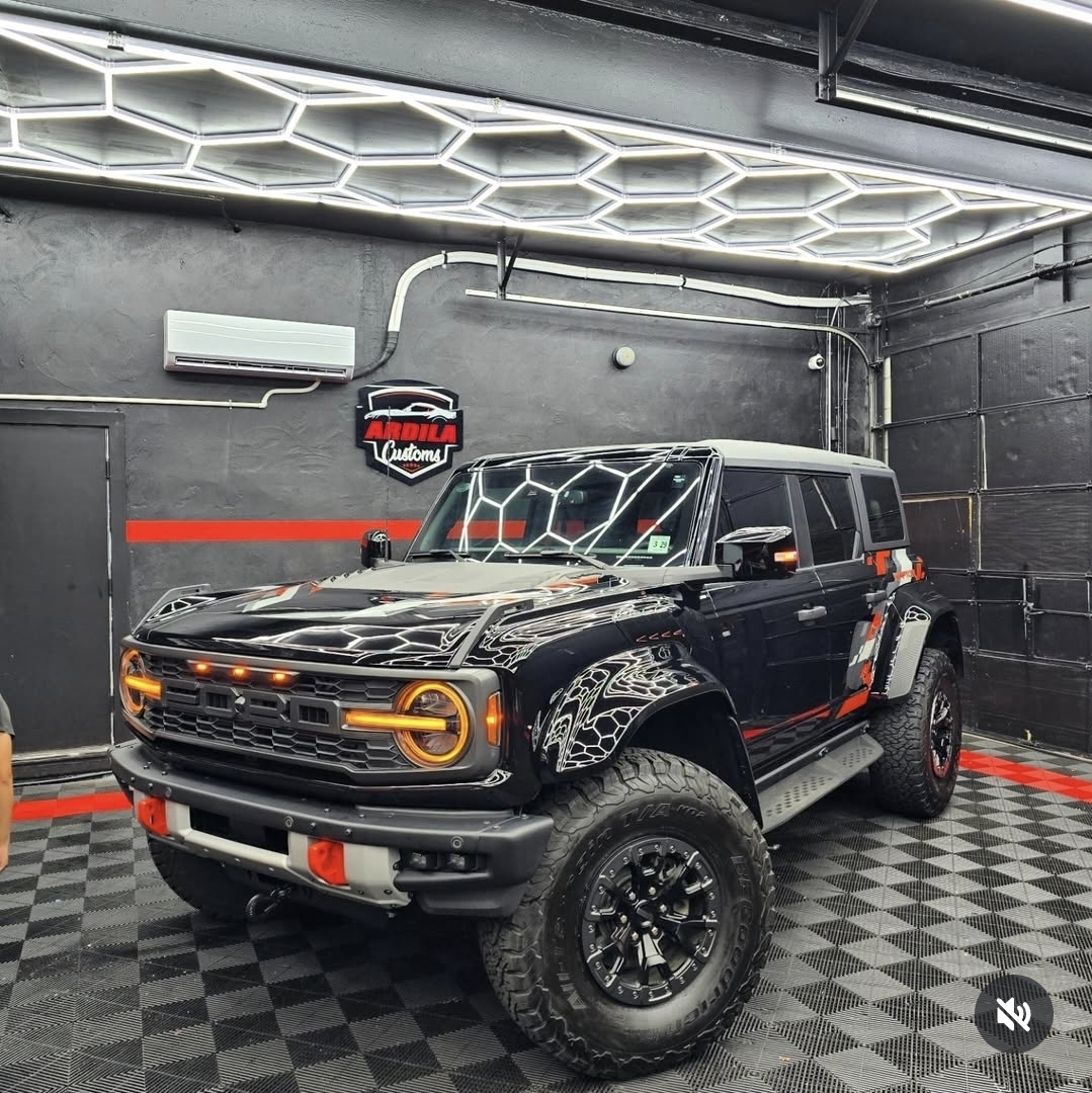 Ford Bronco Raptor with full body gloss paint protection film inside the shop