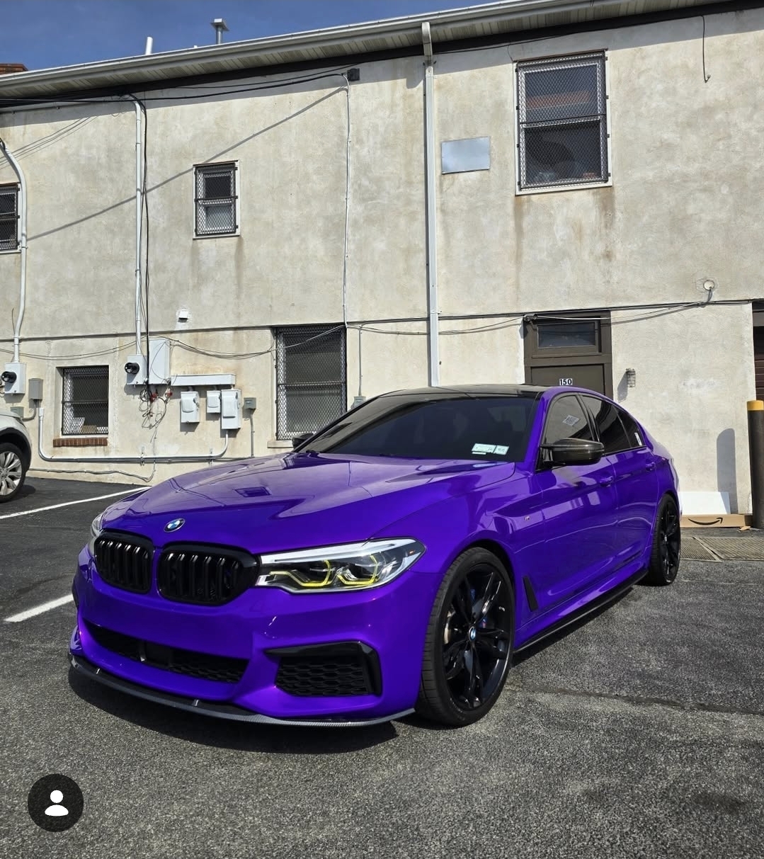 Gloss purple BMW 5 Series wrapped in TeckWrap vinyl